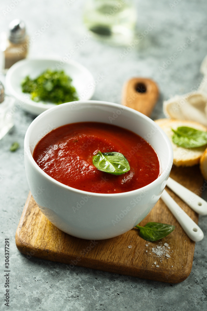 Homemade tomato soup in a white bowl Homemade tomato soup in a white bowl