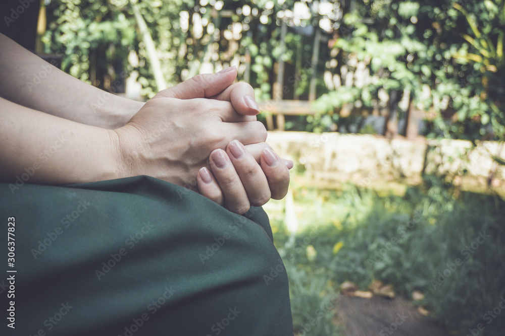 Woman wear green dress action pray in the garden, outdoor. Woman wear green dress action pray in the garden, outdoor.