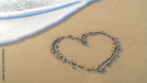 Valentine concept.Image of A heart shape on sandy beach