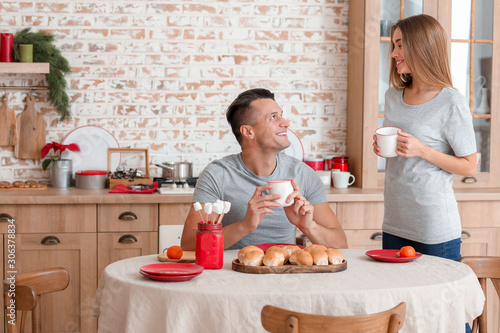 Happy young couple having b...