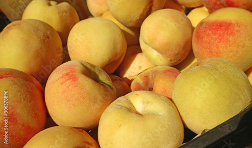 Pile of Fresh Ripe Organic Yellow Peaches For Sale at the Local Market