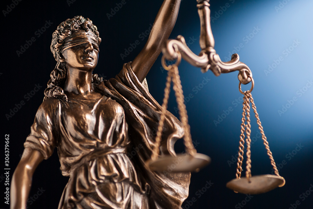 Bronze statue of Justice holding up scales Bronze statue of Justice holding up scales