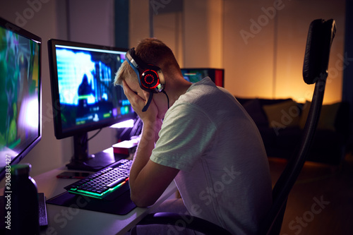 Obraz na płótnie Stressed Teenage Boy Being Bullied Online Whilst Gaming At Home