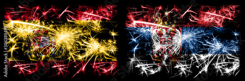 Spanish vs Serbia, Serbian New Year celebration sparkling fireworks flags concept background. Combination of two abstract states flags. © Vlad