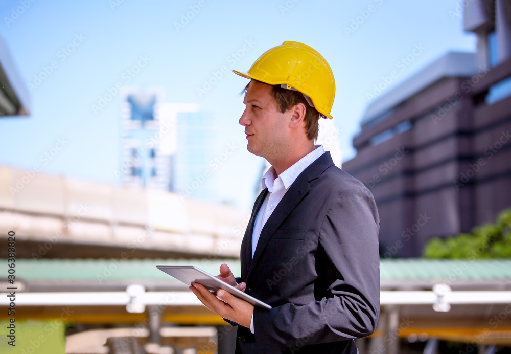 The engineer and business people hand high five against building. The concept of engineering, construction, city life and future. The engineer and business people hand high five against building. The concept of engineering, construction, city life and future.