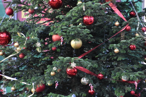 Close up on the decorations of a Christmas tree outdoors
