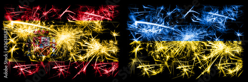 Spanish vs Ukraine, Ukrainian New Year celebration sparkling fireworks flags concept background. Combination of two abstract states flags. © Vlad