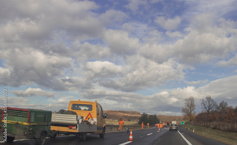 Man at work at highway, near Belgrade town, Serbia Man at work at highway, near Belgrade town, Serbia