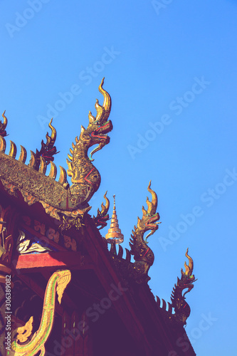 Phaya Naga or serpent on gable apex of church is Thai architectural elements of Buddhism.