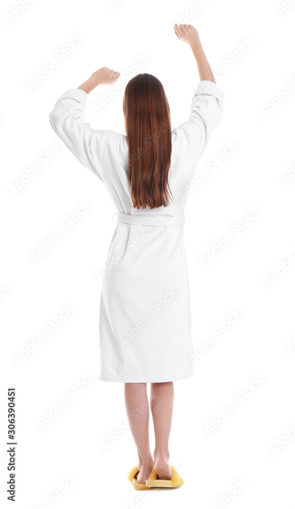 Young woman in bathrobe on white background