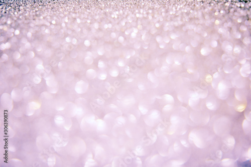 Beautiful Abstract Sparkle Glitter Lights Background. Soft Pale Pink Lilac Silver. Shine Bokeh Effect. For party, holidays, celebration.