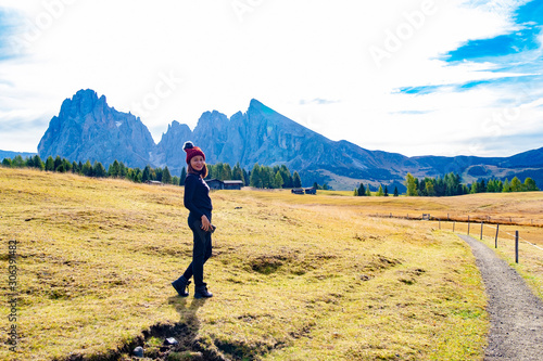 Tourist with Beautiful landscape view of Dolomite Unesco World  heritage at Alpe di cisles, Ortisei Italy. photo