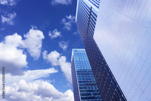 The modern city architecture is photographed under the blue sky