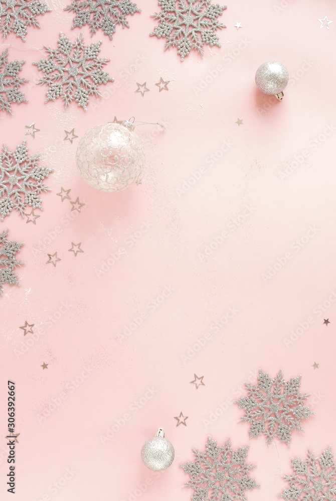 Christmas background. Xmas or new year white silver color decorations on pastel pink background with empty copy space for text. holiday and celebration concept for postcard or invitation. top view Christmas background. Xmas or new year white silver color decorations on pastel pink background with empty copy space for text. holiday and celebration concept for postcard or invitation. top view