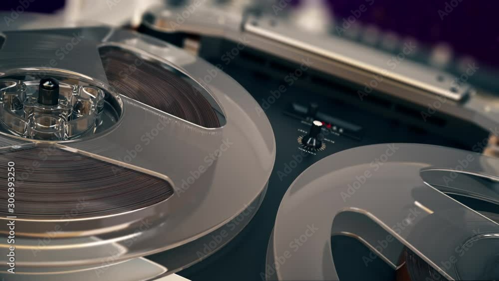 Closeup shot of spinning reels on old analogue reel-to-reel audio tape recorder Rotation reel with tape. Loopable background for audio or voice listening. 4K UHD ProRes.