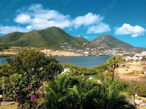 Beautiful sunny day on island in caribbean with mountains and nature around.