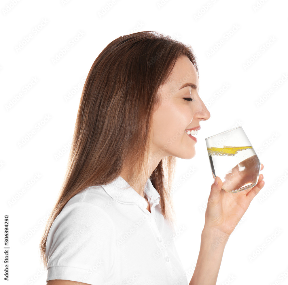 Young woman drinking lemon water on white background Young woman drinking lemon water on white background