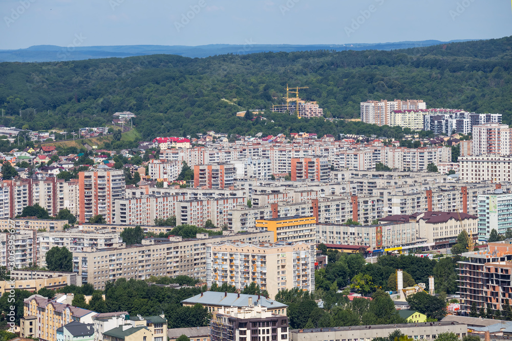 view from a top to small town among green parks view from a top to small town among green parks