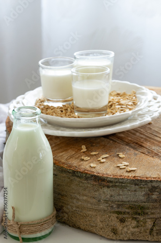 Fresh oat milk drink. Healthy nutritional ingredient, dairy themes