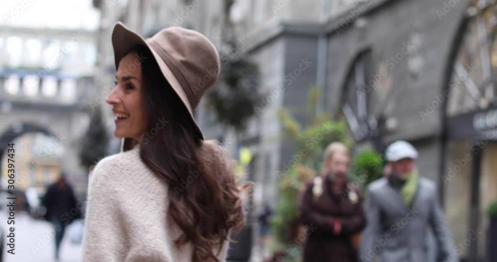 Beautiful young woman walking down city street Beautiful young woman walking down city street