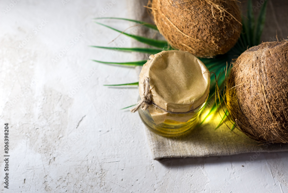 coconut and bottle of coconut palm oil. healthy food vegan aromatherapy concept
