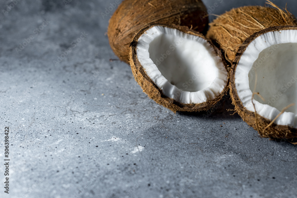 ripe chopped coconut on a gray stone background. place for your text ripe chopped coconut on a gray stone background. place for your text