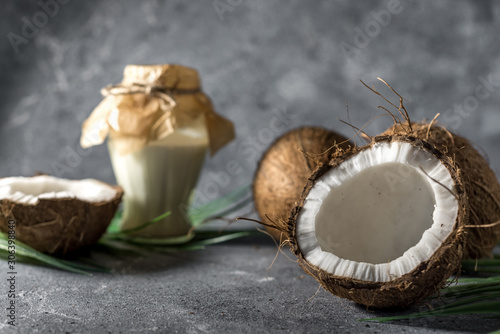 ripe chopped coconut on a gray stone background Coconut oil.