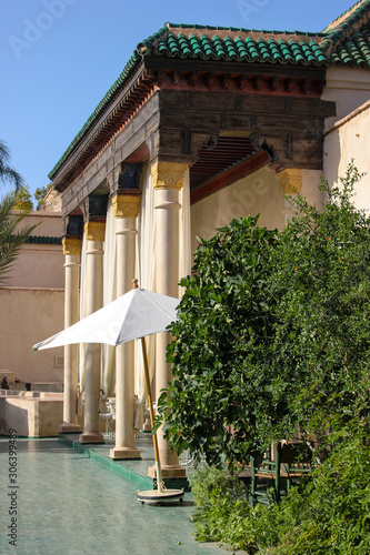 Entrance with pillars in the secret jardin (garden), Marrakech, Morocco. With beautiful golden decorations.