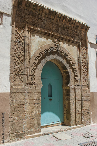 Beautiful decorated typical moroccan entrance with a mint green door, Essaouira, Morocco photo