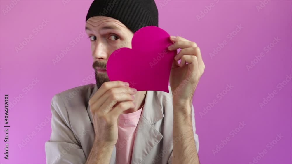 handsome bearded man showing paper heart happy valentines day concept handsome bearded man showing paper heart happy valentines day concept