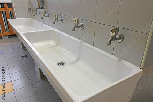 white ceramic washbasin of a school