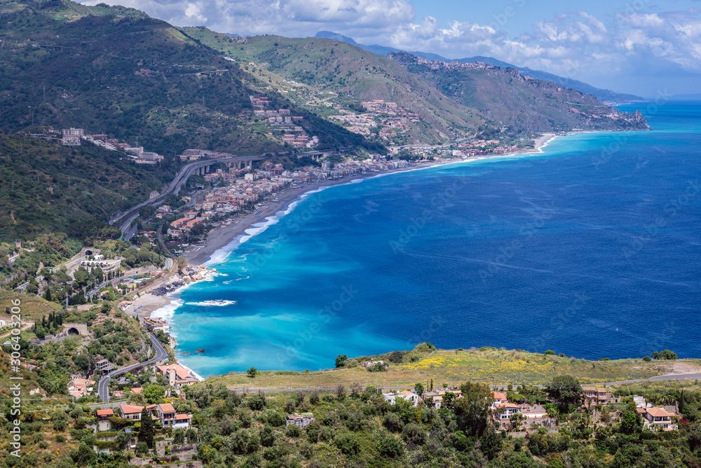 Ionian Sea coast seen from a area of Greek Theatre in Taormina city, Sicily Island, Italy