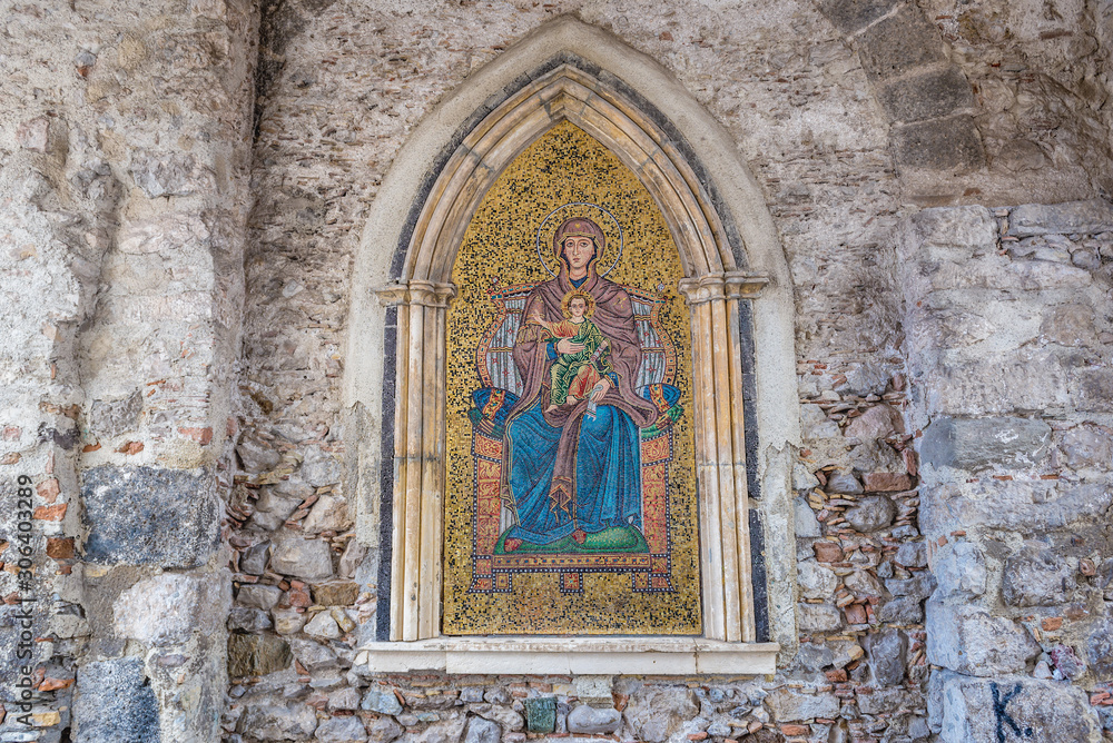 Madonna with a Child mosaic on a wall of Clock Tower located on Square of 9th April in Taromina city, Sicily Island, Italy