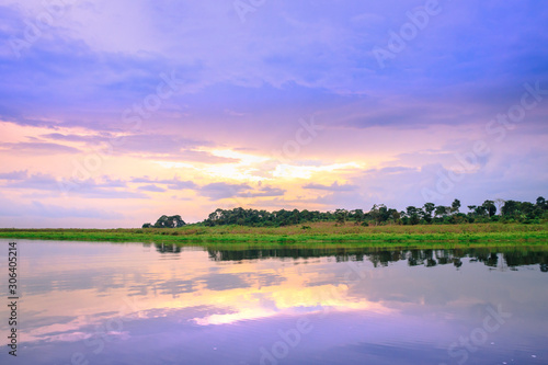 Sunset view of Mabamba Swamp from a little wooden fishing boat, Entebbe, Uganda, Africa photo