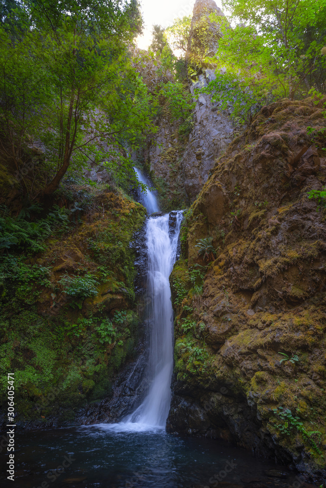 Sunshine over Hole In The Wall Waterfall in Oregon Sunshine over Hole In The Wall Waterfall in Oregon