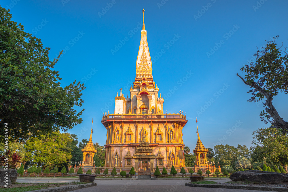 Chalong pagoda in blue sky. Wat Chalong is the largest and most revered in Phuket..all tourists like to visit Chalong temple.The beautiful temple complex was built in Thai East style.