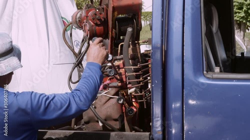 mechanic at work with mobile crane