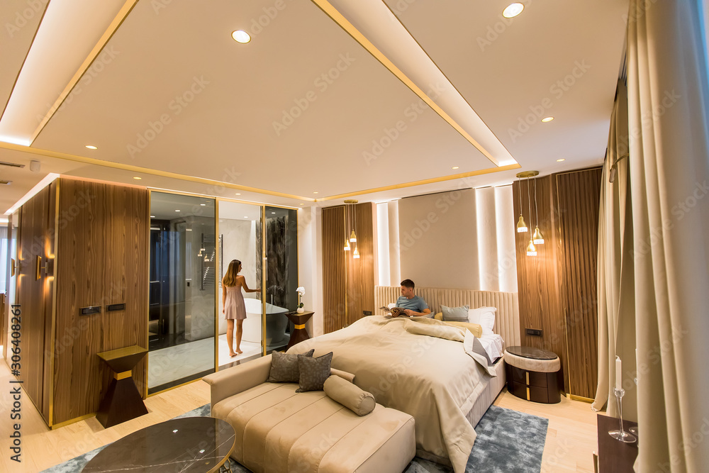 Relaxed young lovers in the luxurious apartment in the night Relaxed young lovers in the luxurious apartment in the night