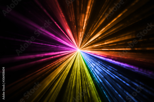 Multicolor laser light beams rainbow taken in the dark room