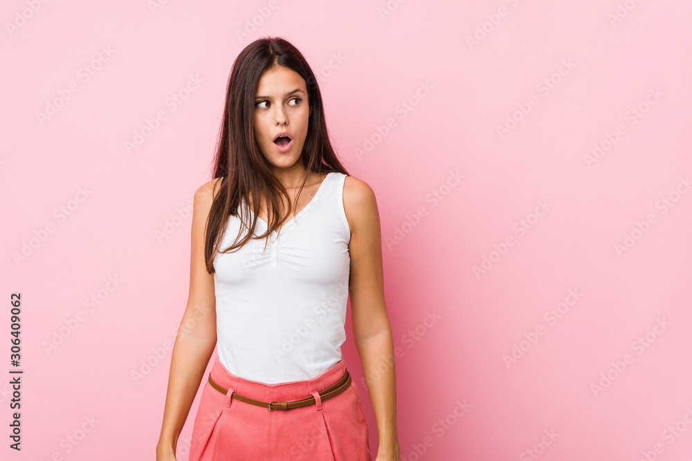 Young cute woman being shocked because of something she has seen. Young cute woman being shocked because of something she has seen.