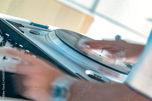closeup of turntable with Dj in action