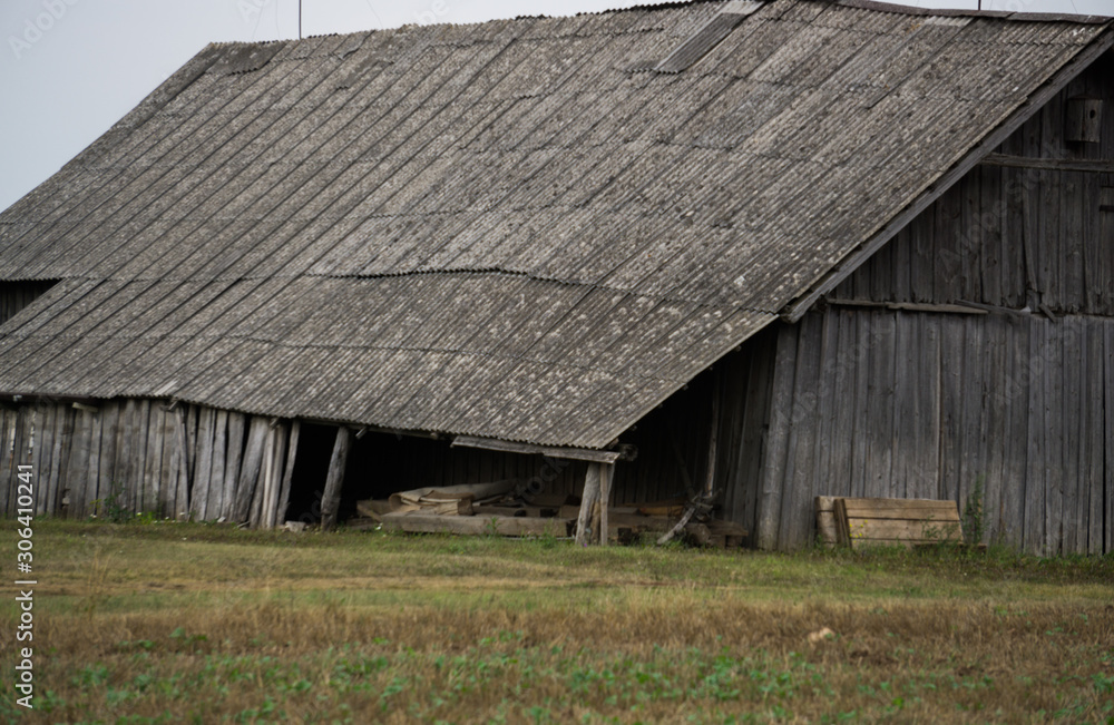 Old wooden buildings in the village, built in the middle of the last century. Old wooden buildings in the village, built in the middle of the last century.