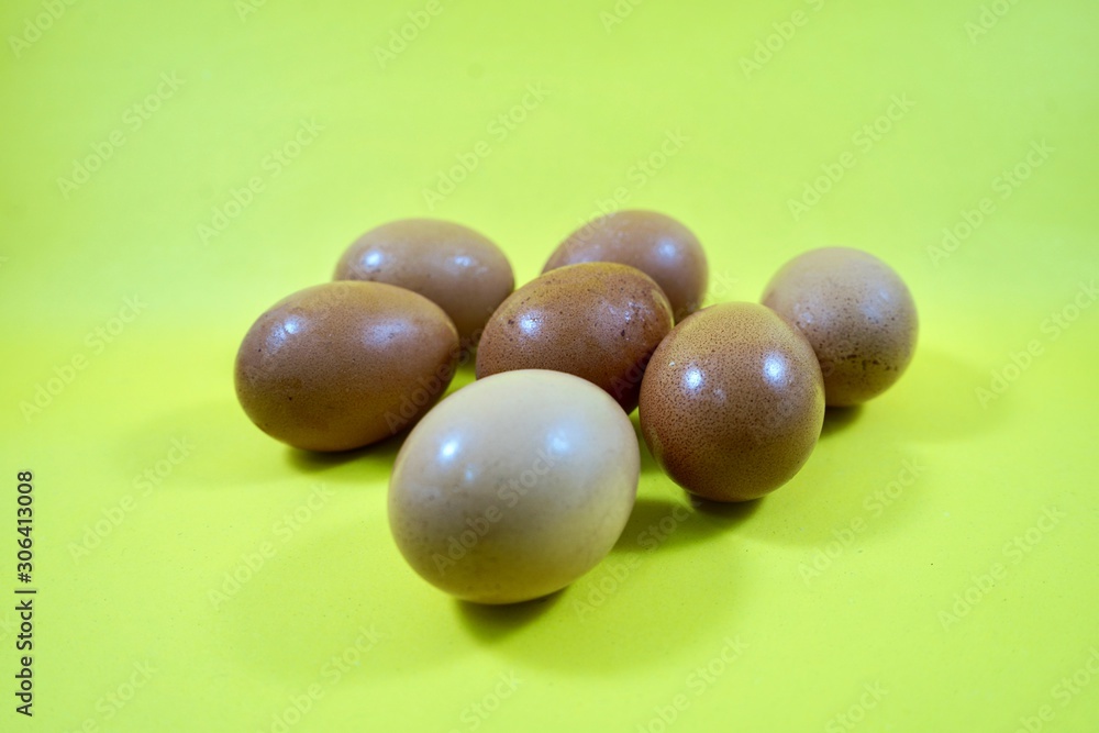 eggs isolated on yellow background eggs isolated on yellow background