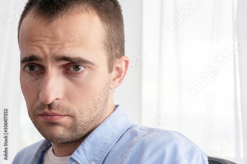 Portrait of a sad man is depressed, close up, toned