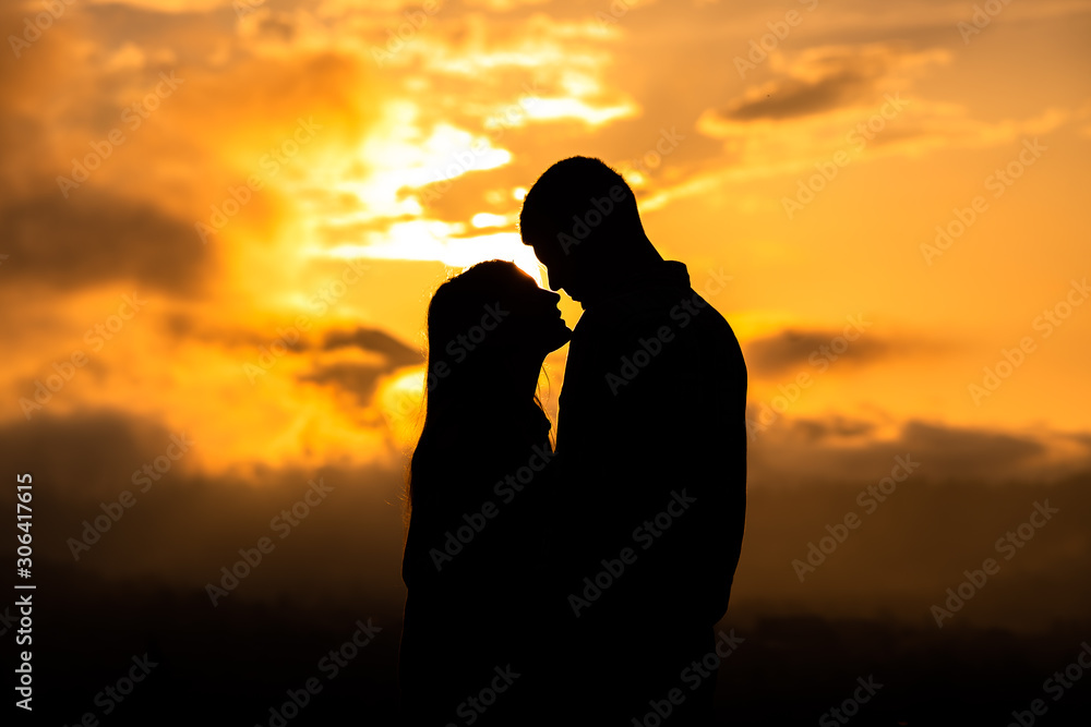 silhouette of a couple in love at sunset