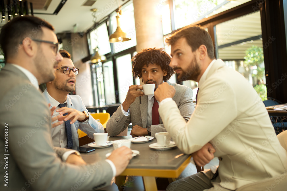 Funny conversation four businessmen while sit pub and drinking coffee after work Funny conversation four businessmen while sit pub and drinking coffee after work