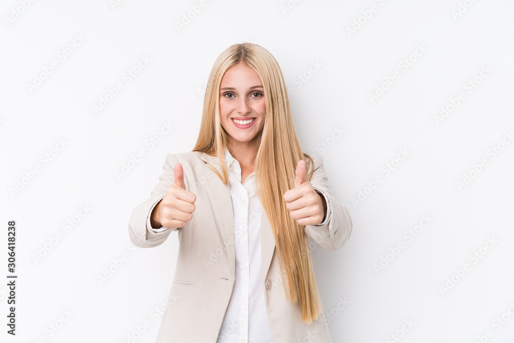 Young business blonde woman on white background with thumbs ups, cheers about something, support and respect concept. Young business blonde woman on white background with thumbs ups, cheers about something, support and respect concept.