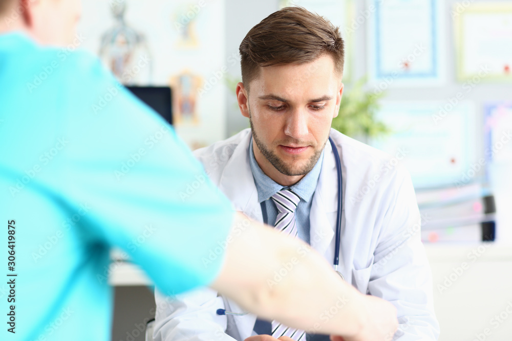 Worried physician in hospital cabinet Worried physician in hospital cabinet