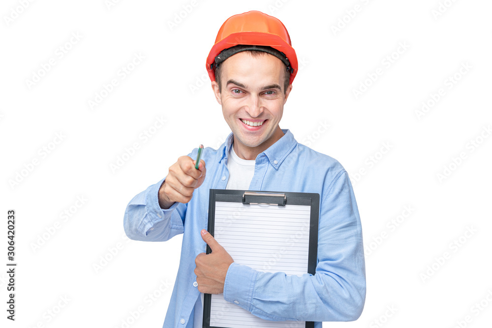 Builder in hardhat, man smiling and indicates at you, man holding a notepad, isolated background, copy space Builder in hardhat, man smiling and indicates at you, man holding a notepad, isolated background, copy space
