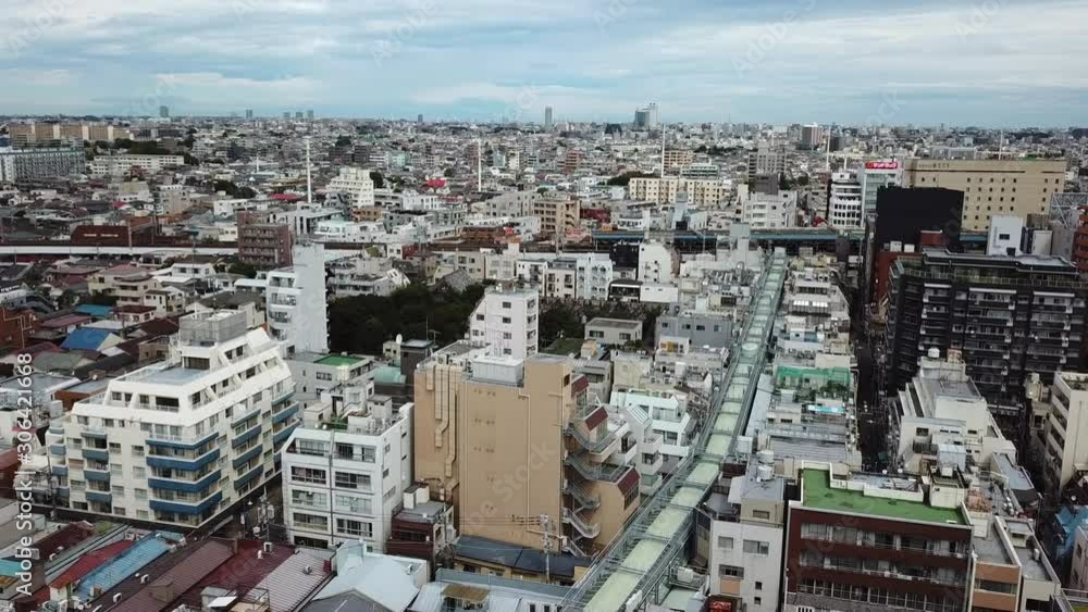 Metro Tokyo, Koenjikita District, Ascending Aerial View on Residental Buildings and Railway